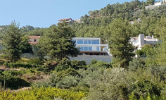 A four bedroom house for sale perfectly located in a forest outside Moniatis with beautiful mountain views around