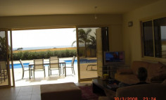 A three bedroom house with swimming pool for sale first line to the beach in Pervolia 