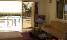 A three bedroom house with swimming pool for sale first line to the beach in Pervolia 