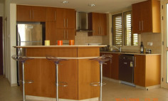 A three bedroom house with swimming pool for sale first line to the beach in Pervolia 