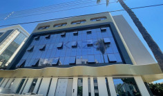 Brand new modern commercial building with rooftop 