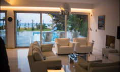 For sale two beachfront plots of land with houses in Larnaca 